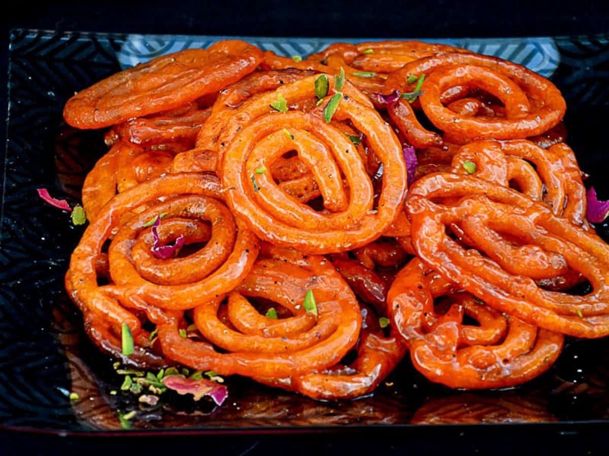 Crispy jalebi spirals soaked in sugar syrup