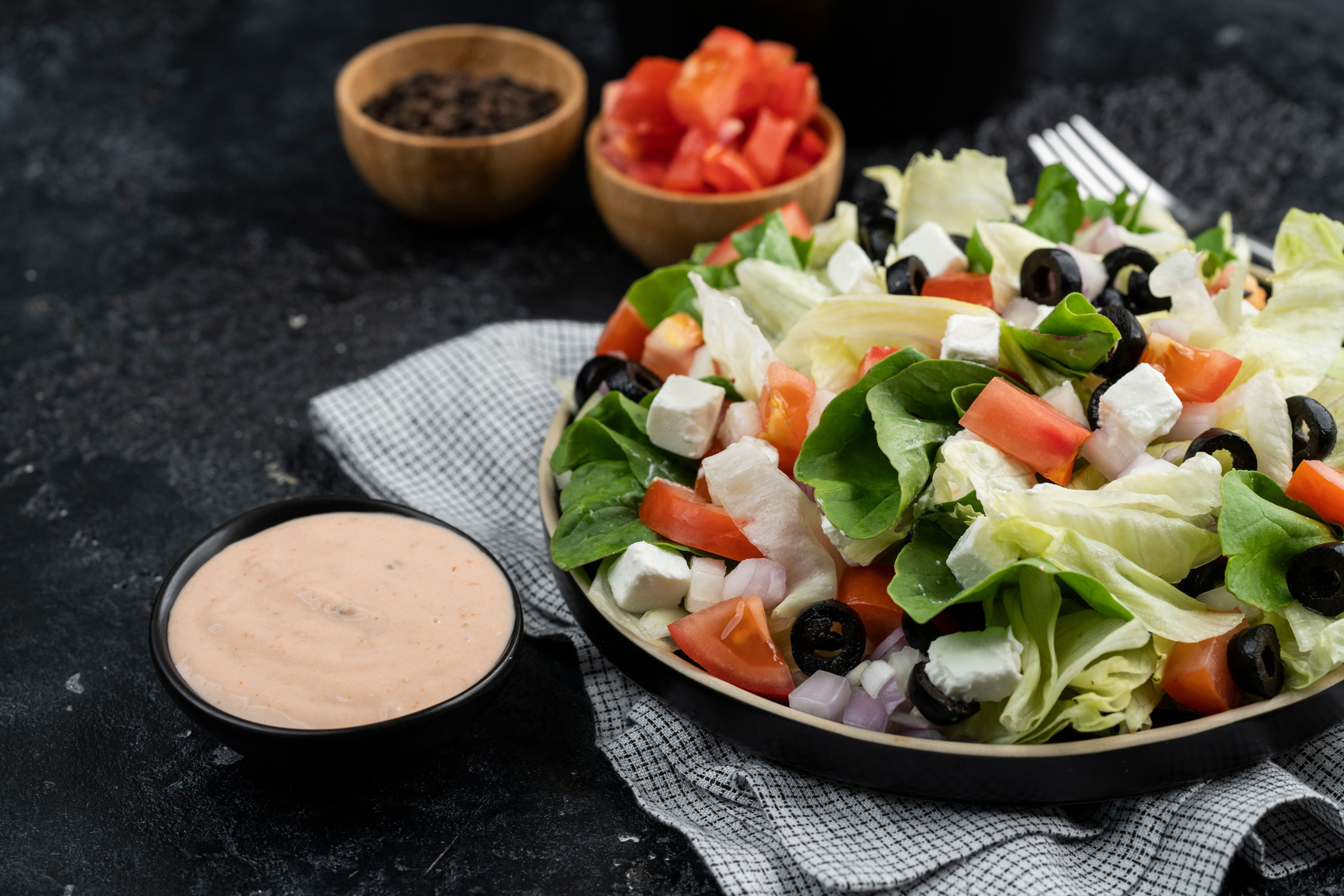 Traditional Greek salad with tomatoes, cucumber, green pepper, Kalamata olives and feta cheese