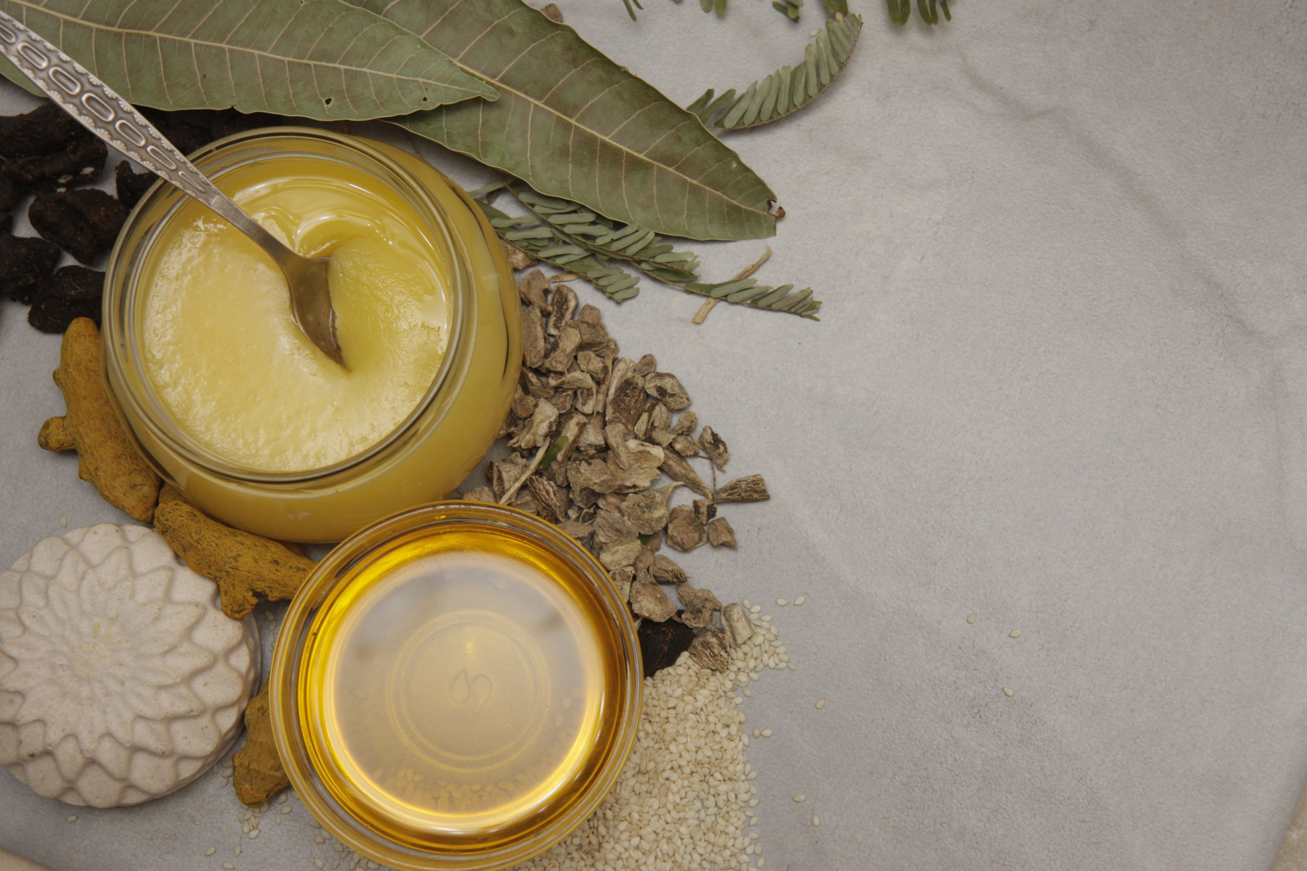 Ghee and butter side by side with a comparison of flavor, smoke point, nutrition, and cooking uses