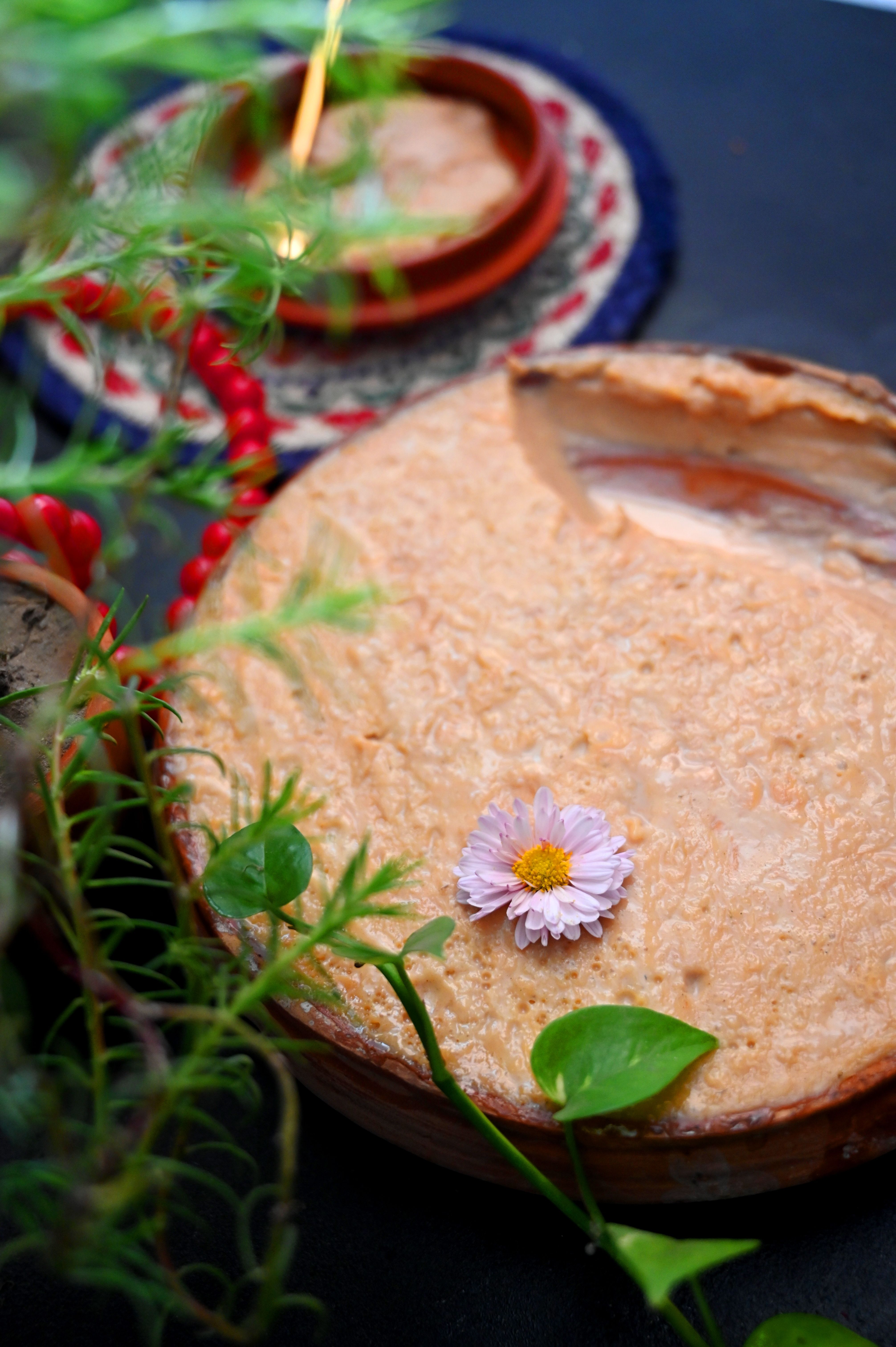 Thick Pakistani-style kheer with basmati rice, cardamom, pistachios, almonds, saffron, and dried rose petals