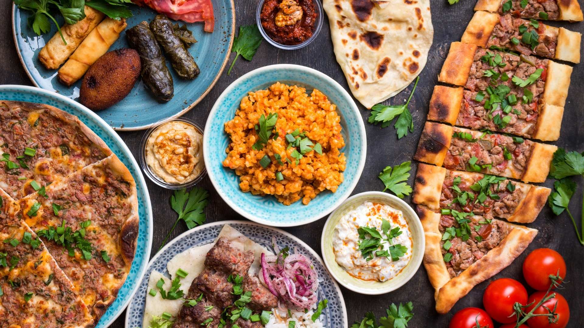 A Turkish cuisine cookbook cover featuring mezze, breakfast spreads, kebabs, breads, and warm hospitality-inspired dishes.