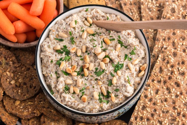 Creamy mutabbal eggplant dip topped with olive oil and herbs.