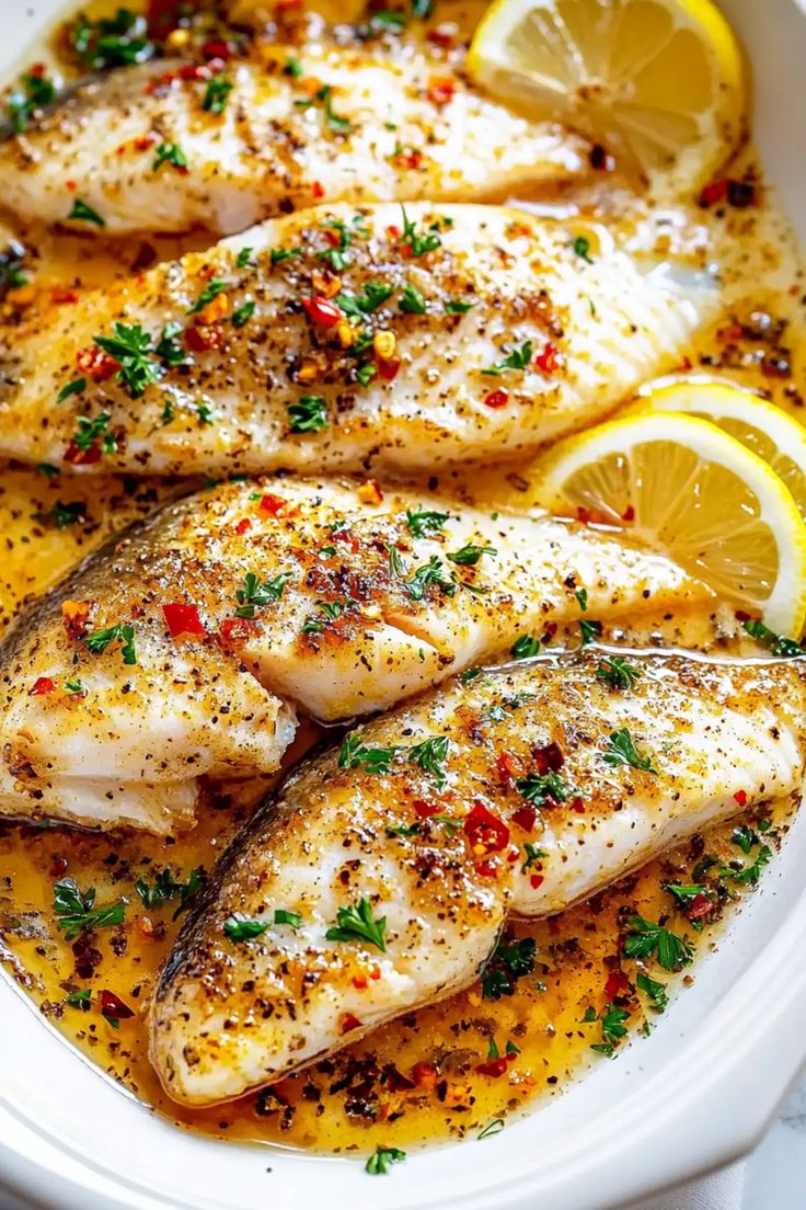 Baked fish fillets with creamy lemon butter sauce.