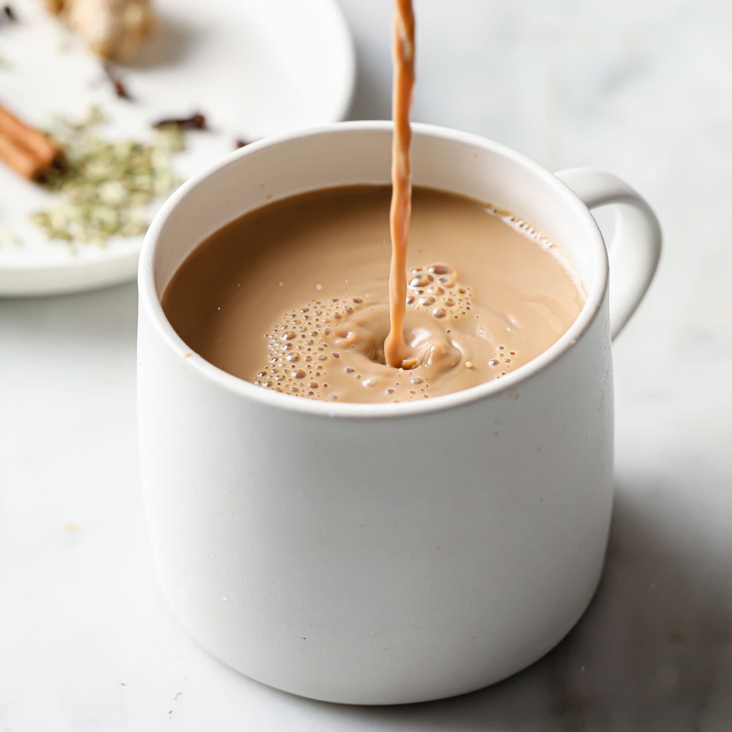 Hot Pakistani chai with milk and aromatic spices