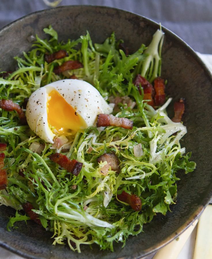 French Salad Lyonnaise with poached egg and crispy topping.