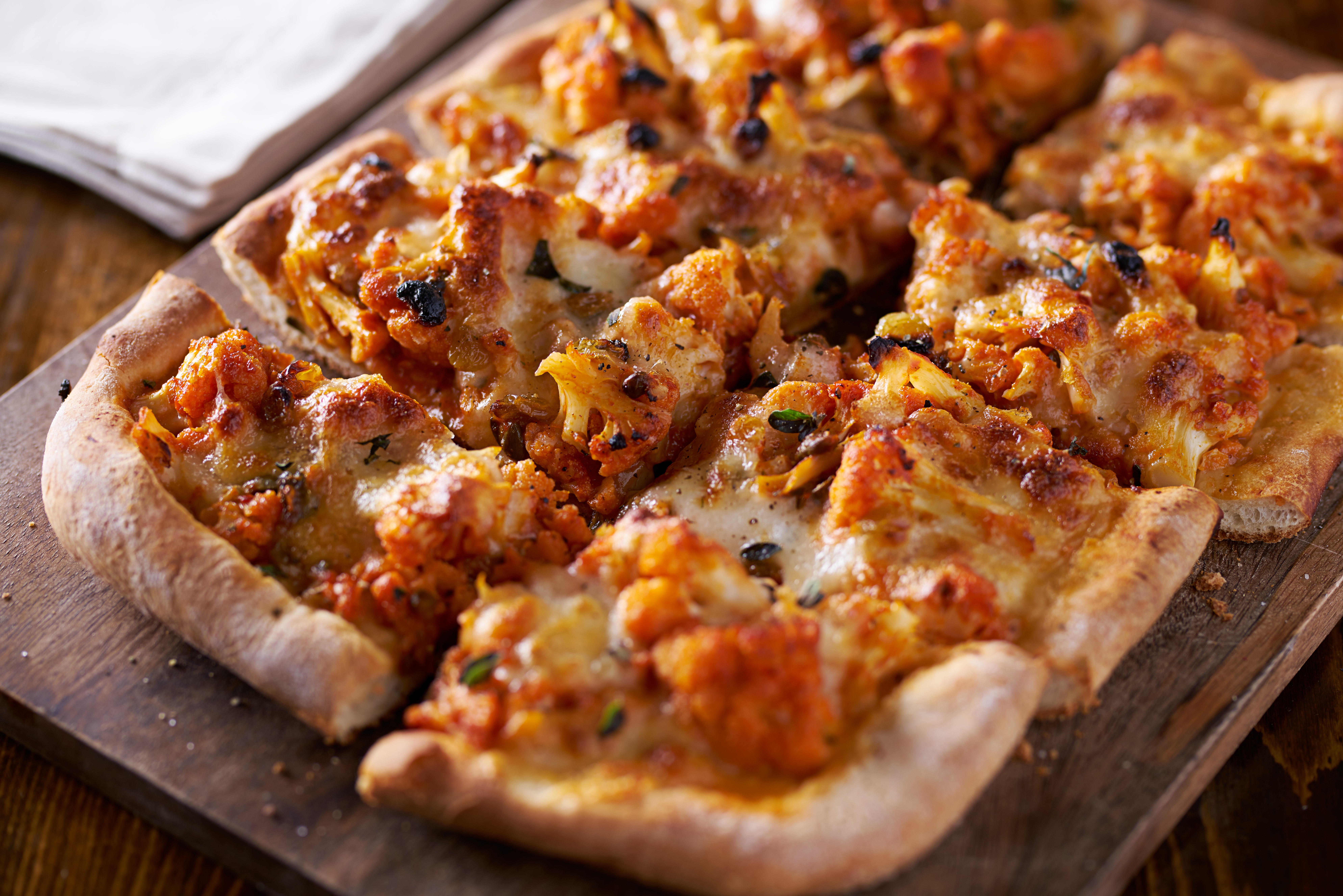 Delicious Pizza with Roasted Cauliflower on Wooden Board