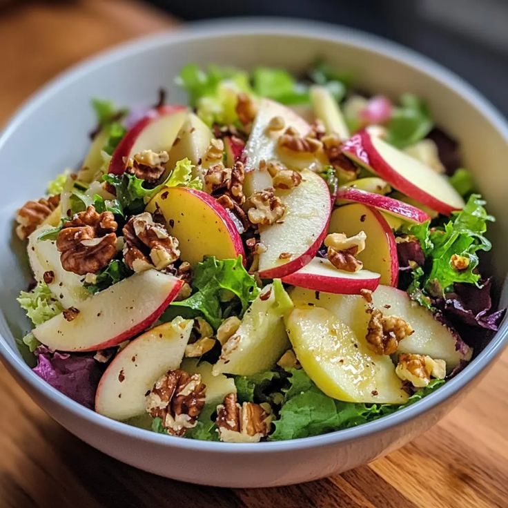 Fresh endive salad with apples, walnuts, and blue cheese.