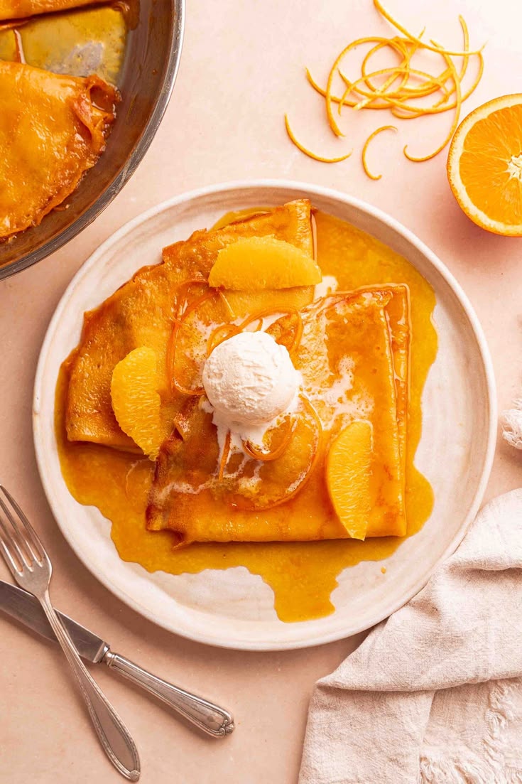 French Crêpes Suzette served with orange caramel sauce.