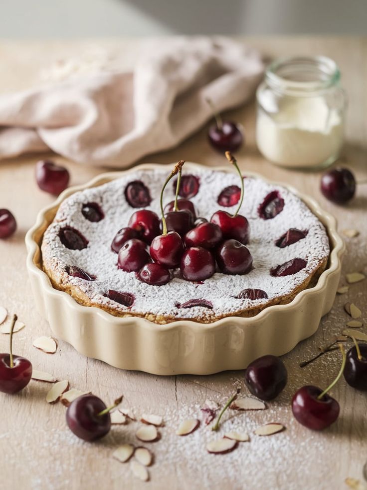 Classic cherry clafoutis dusted with powdered sugar.