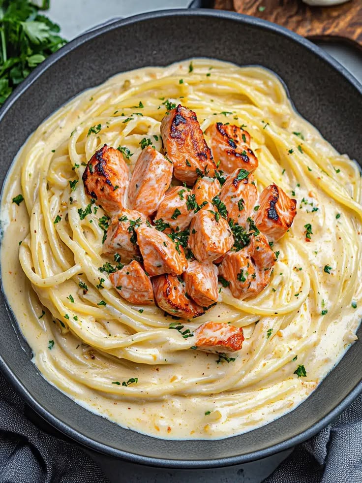 Creamy salmon pasta with herbs and silky French-style sauce.