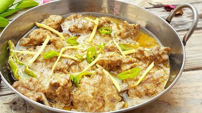 Creamy white chicken karahi with yogurt, green chilies, and ginger