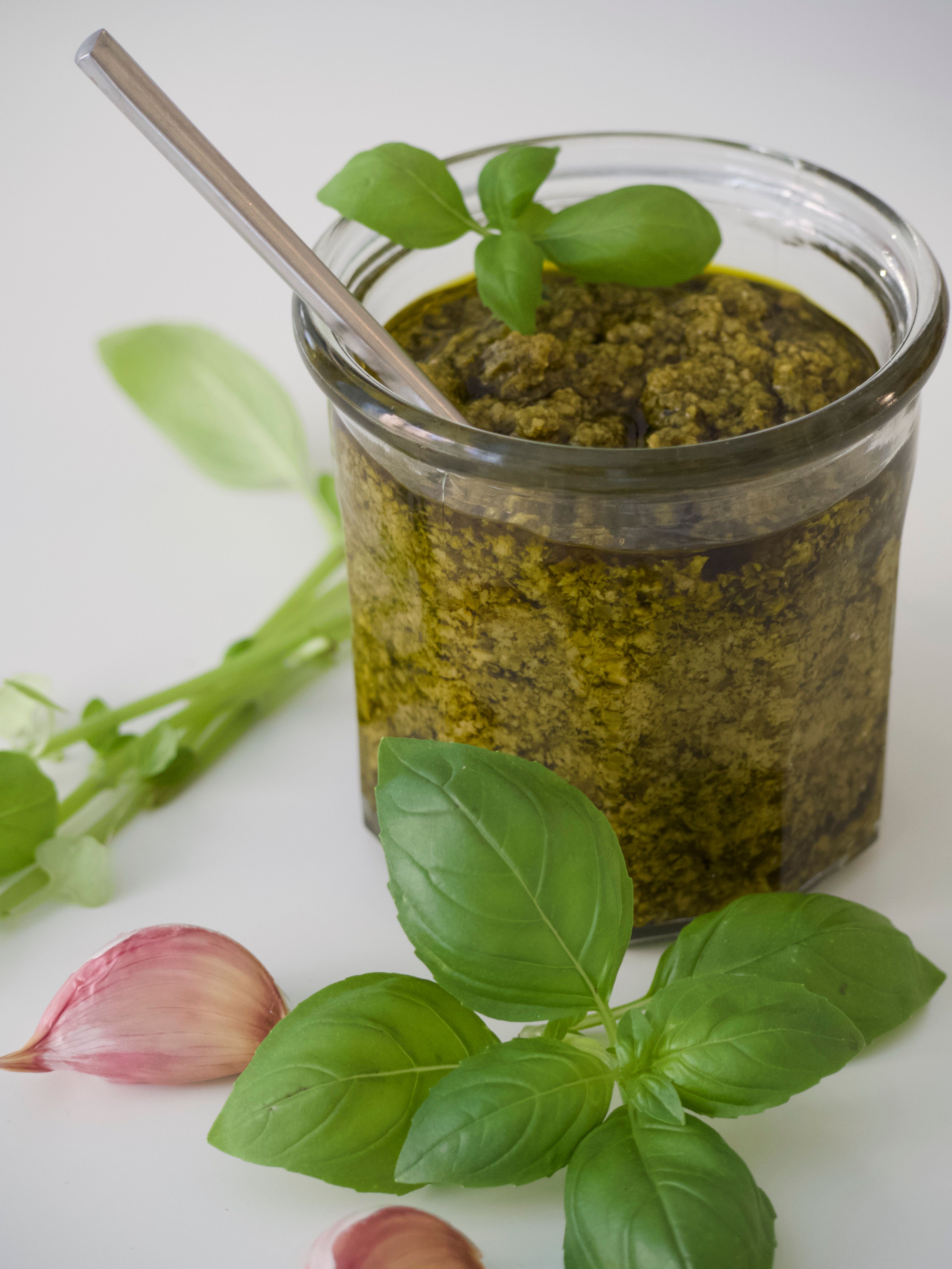 Classic green chimichurri sauce with chopped parsley, garlic and red pepper flakes in a small bowl