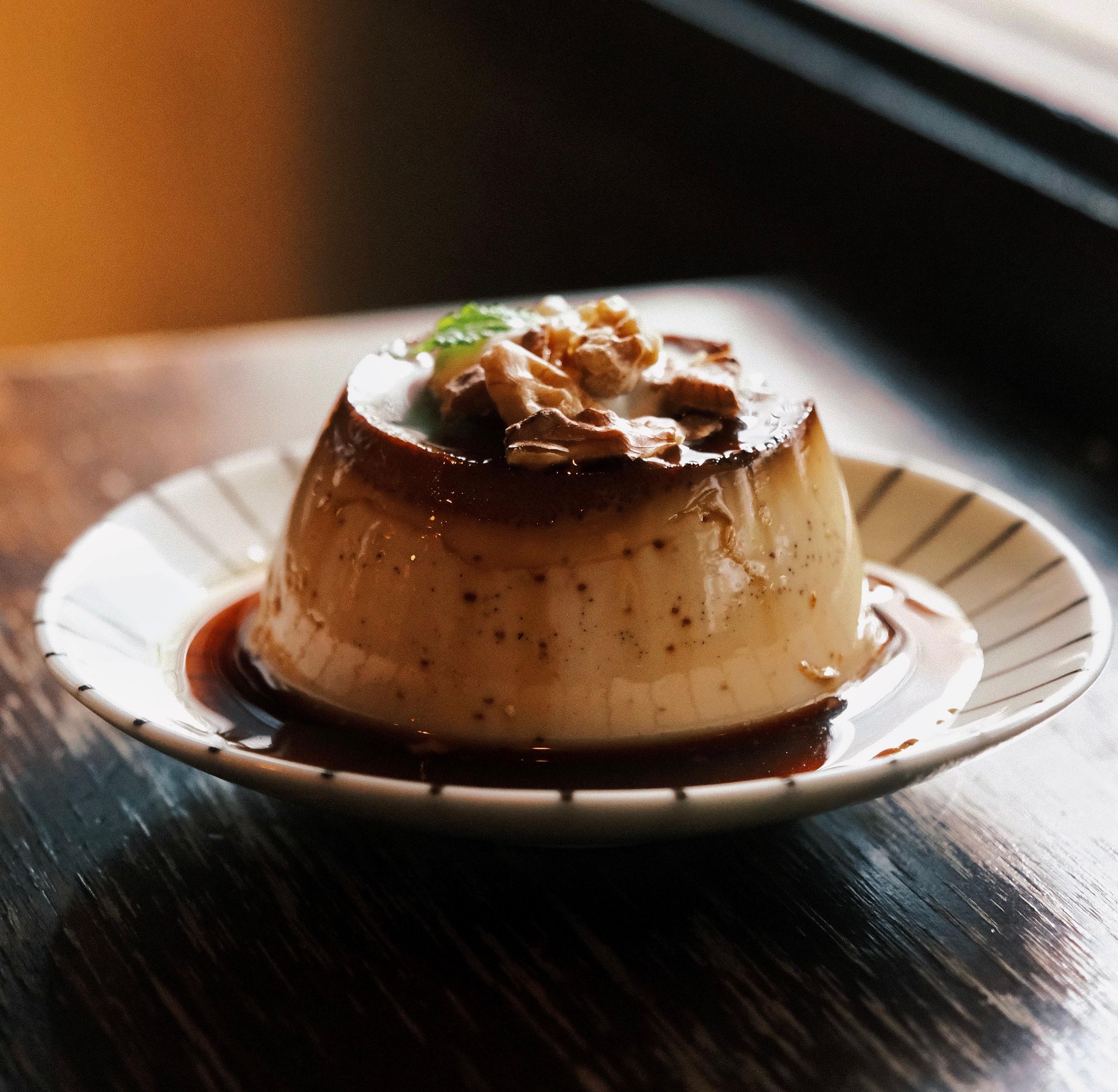 Silky Cuban flan topped with glossy amber caramel sauce and served as a chilled dessert.