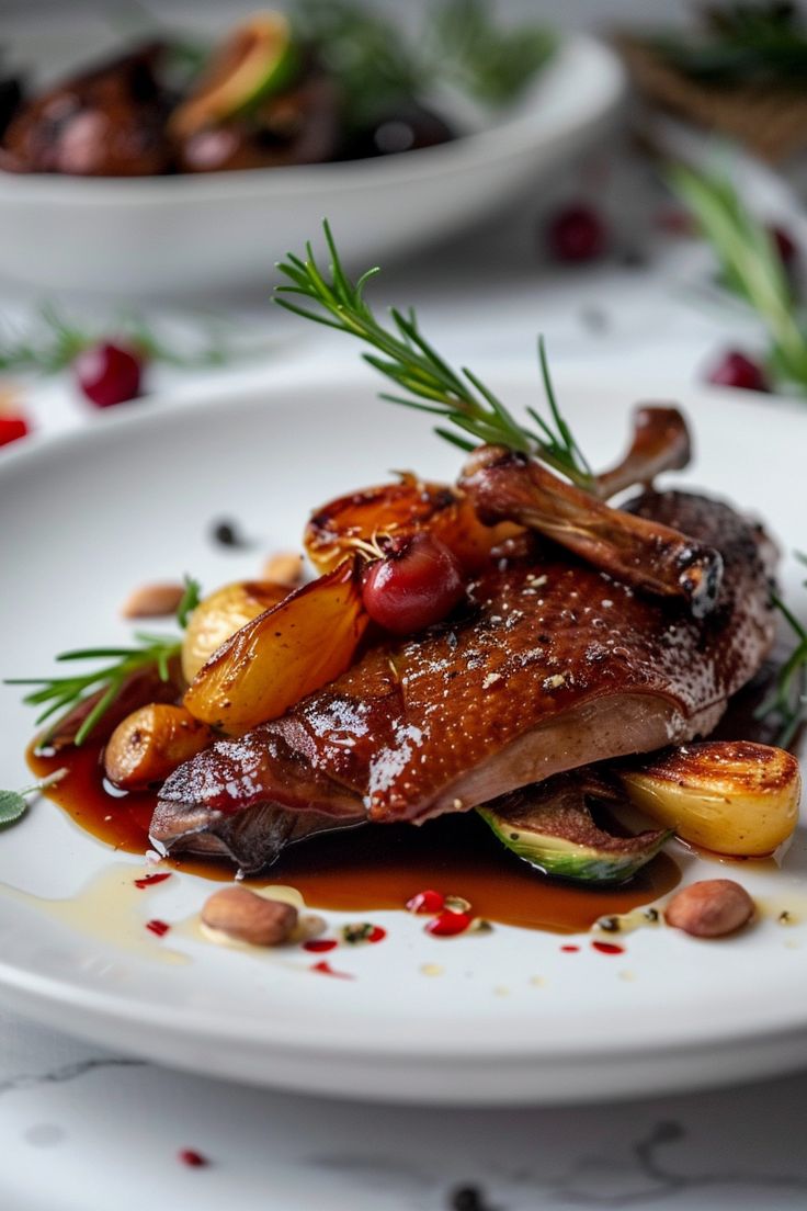 Crispy duck confit legs served golden brown with herbs.