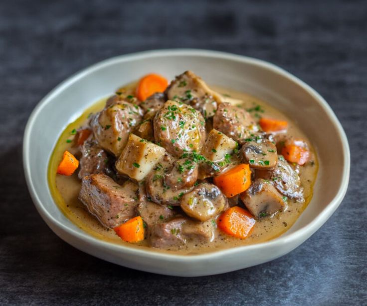 Creamy Blanquette de Veau served with rice and vegetables