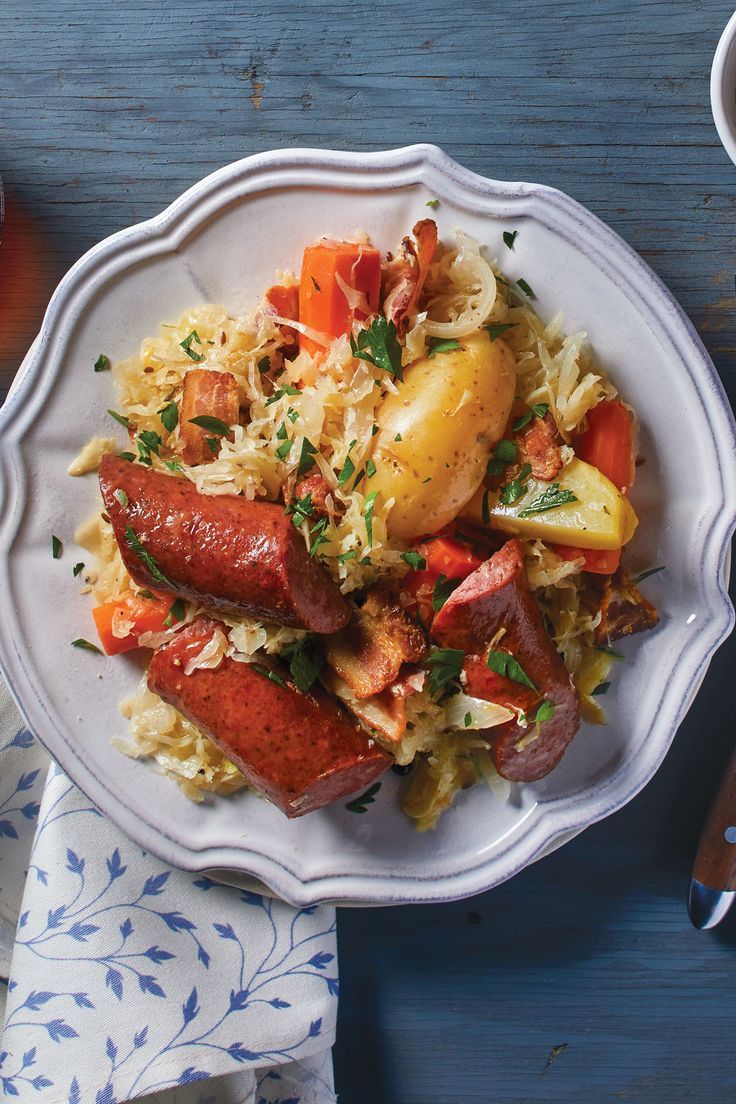 Traditional French choucroute garnie with sausages, meats, potatoes, and sauerkraut.