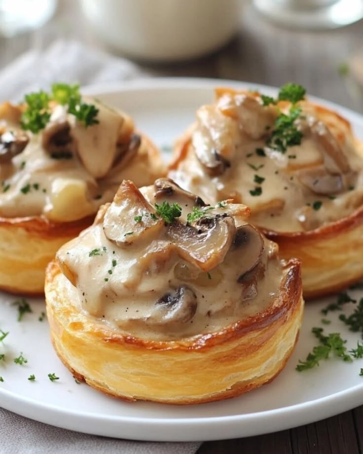 French puff pastry shells filled with creamy chicken and mushroom velouté.